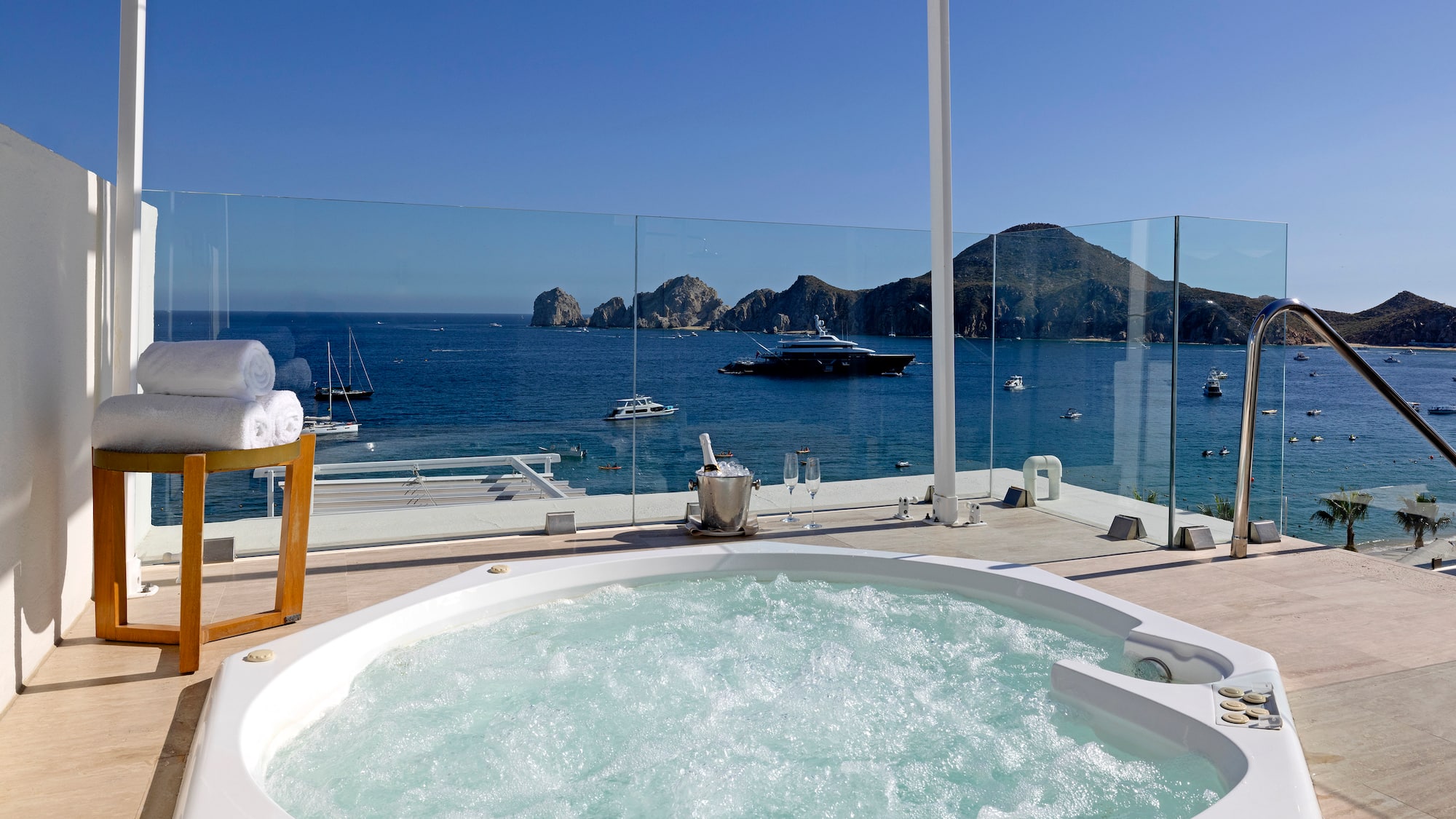 a hot tub with a view of the ocean