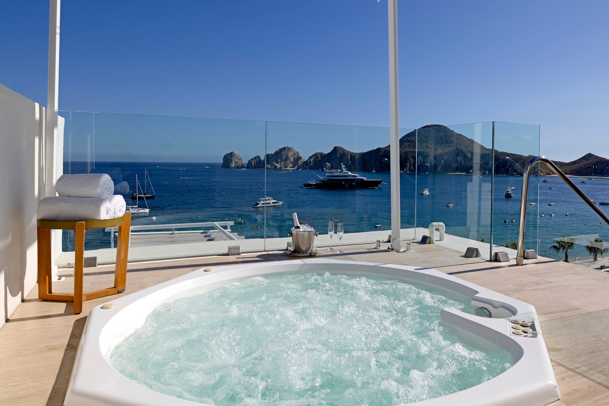 a hot tub with a view of the ocean