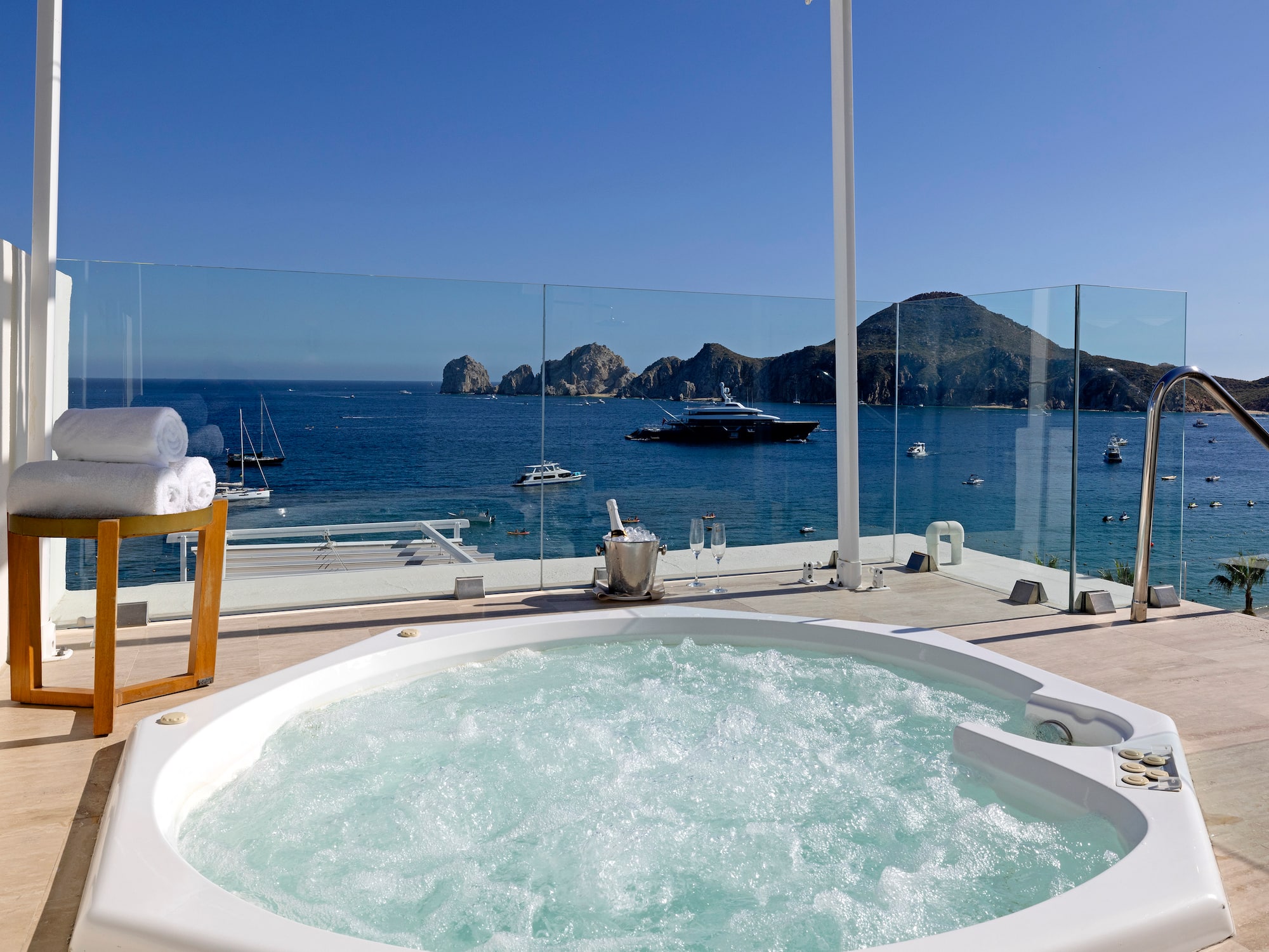 a hot tub with a view of the ocean