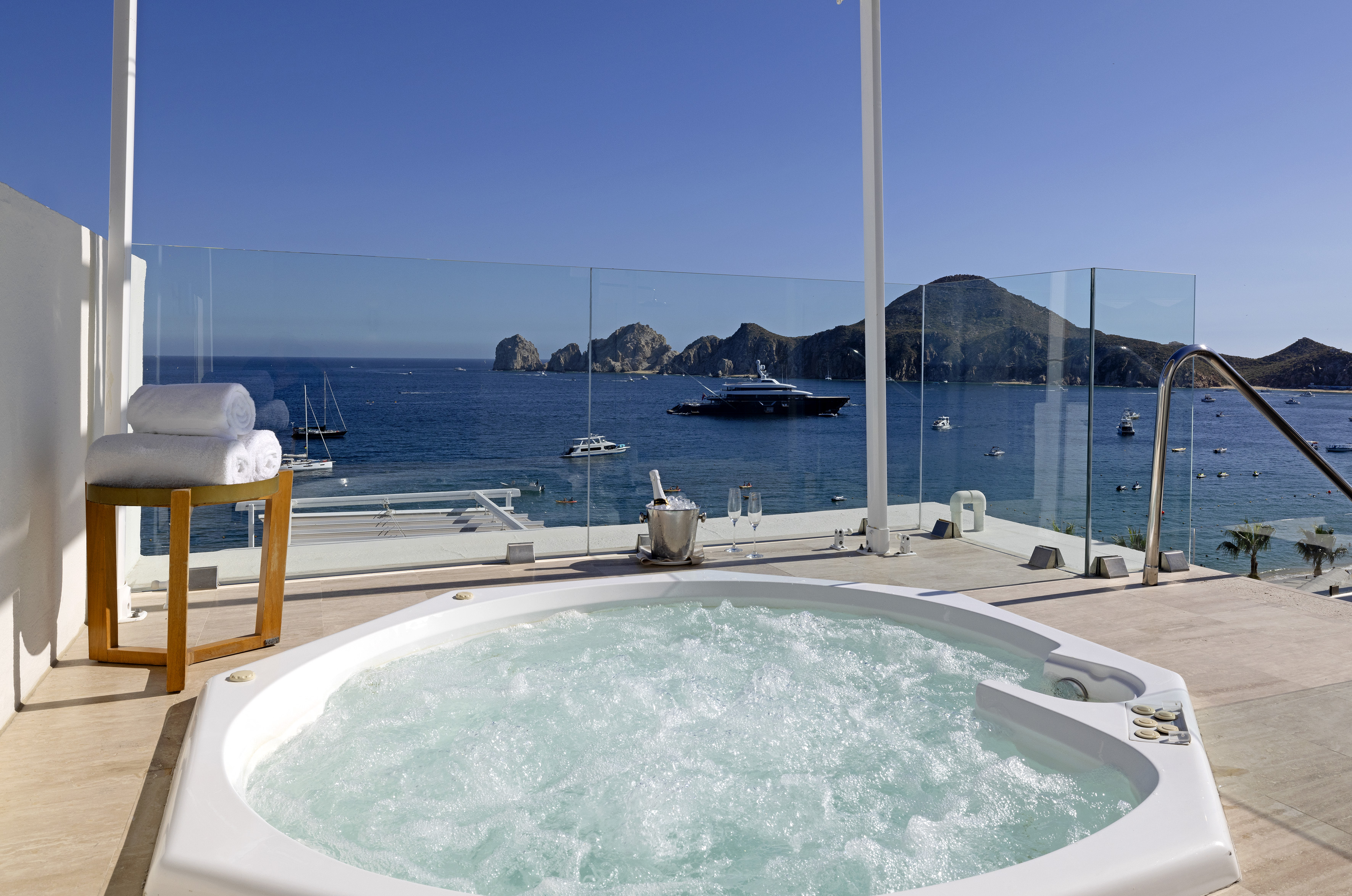 Cabo San Lucas hot tub with ocean view, luxury yacht, and El Arco.