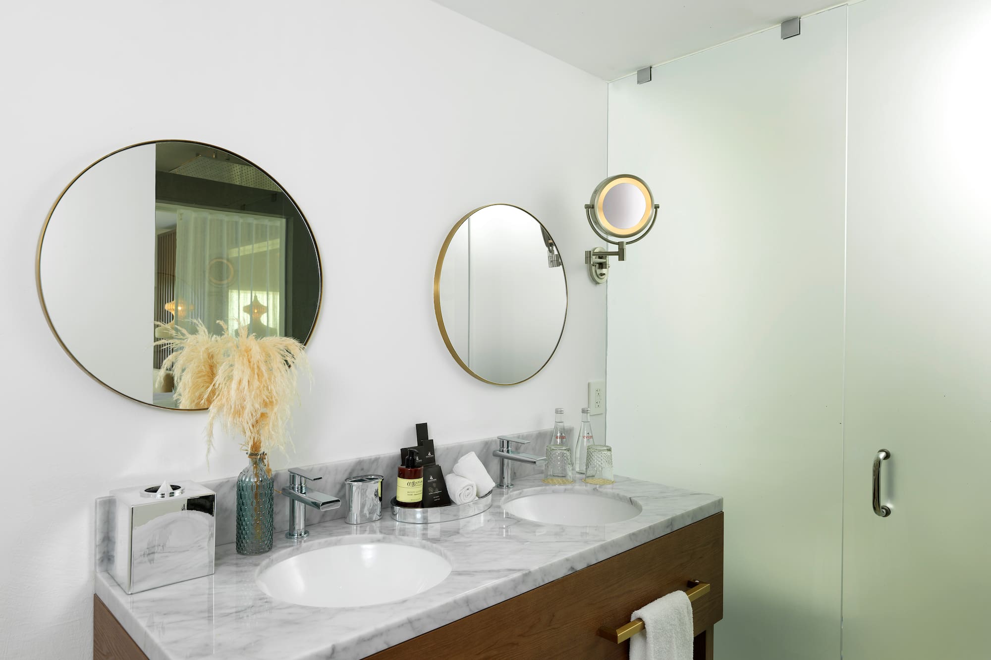 a bathroom with two mirrors