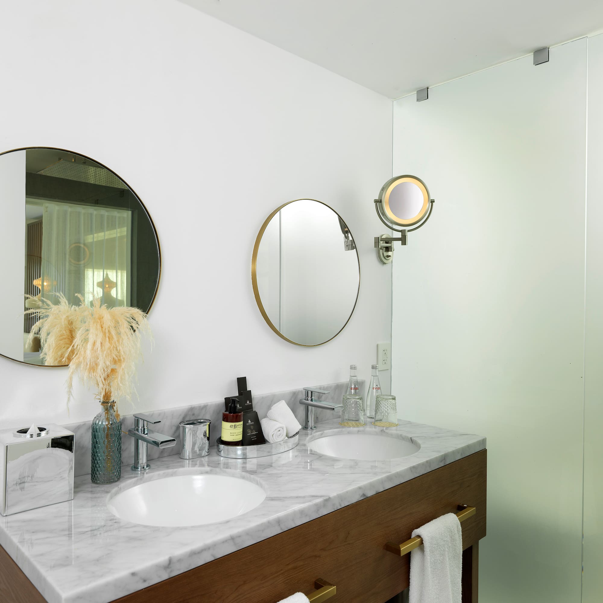 a bathroom with two mirrors