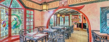 a restaurant with tables and chairs