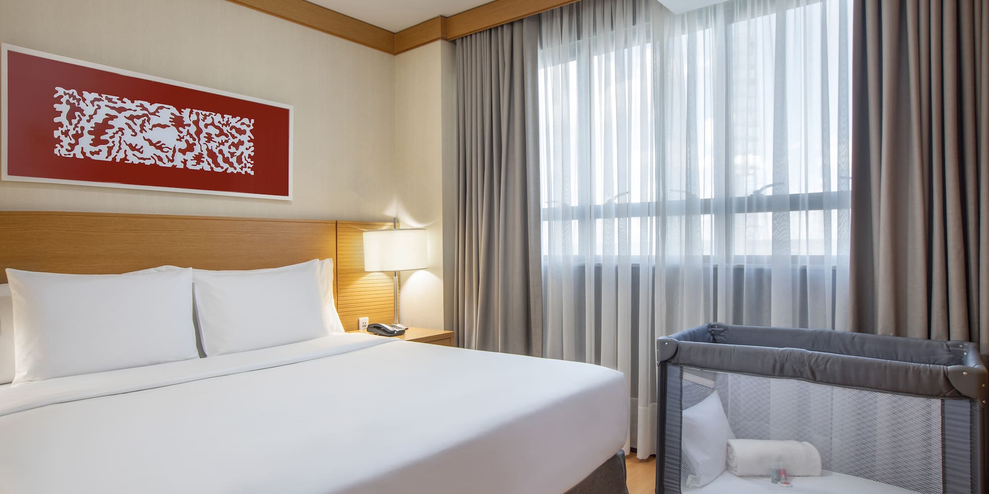 a bed with a crib in a room