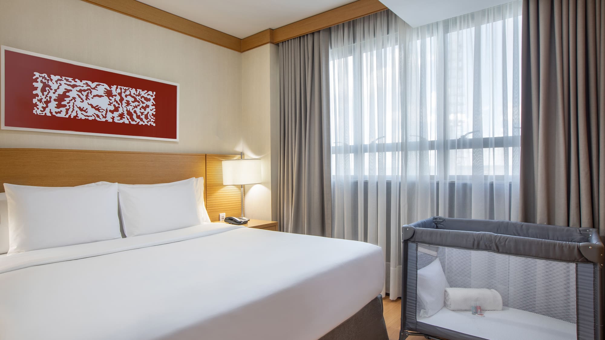 a bed with a crib in a room