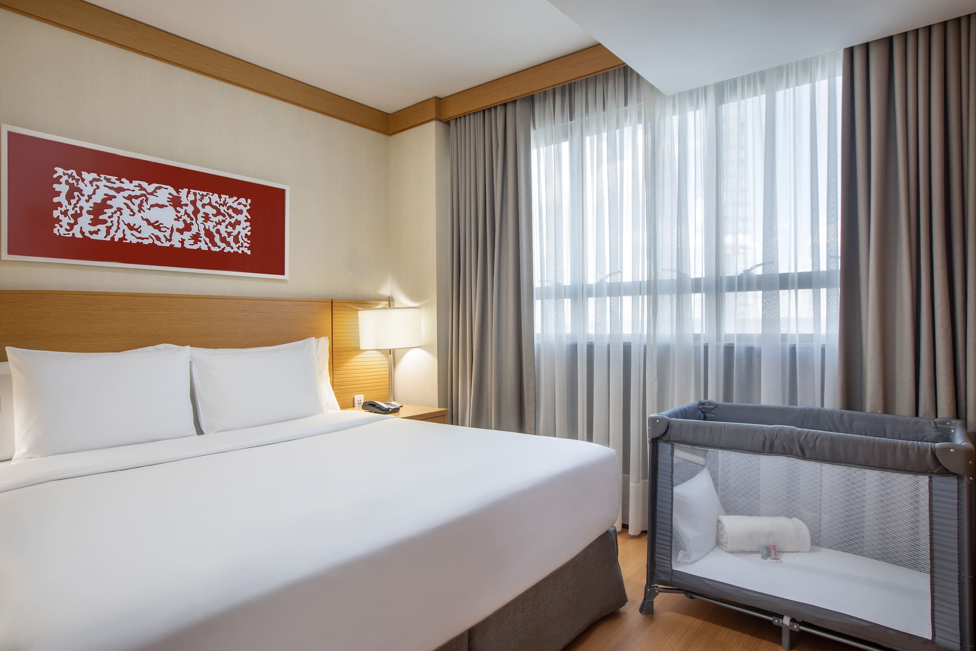 a bed with a crib in a room