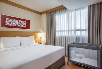 a bed with a crib in a room