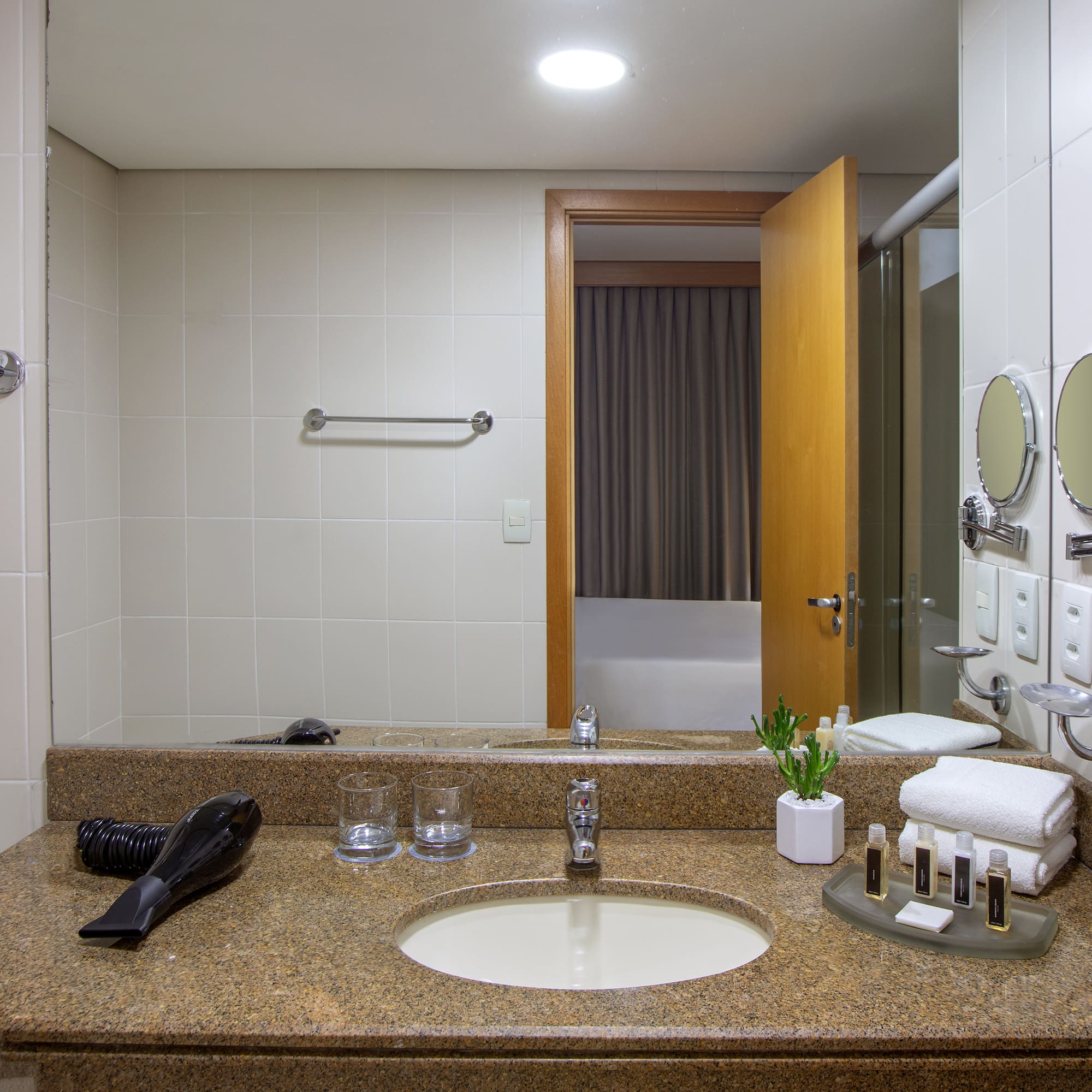 a bathroom with a sink and mirror