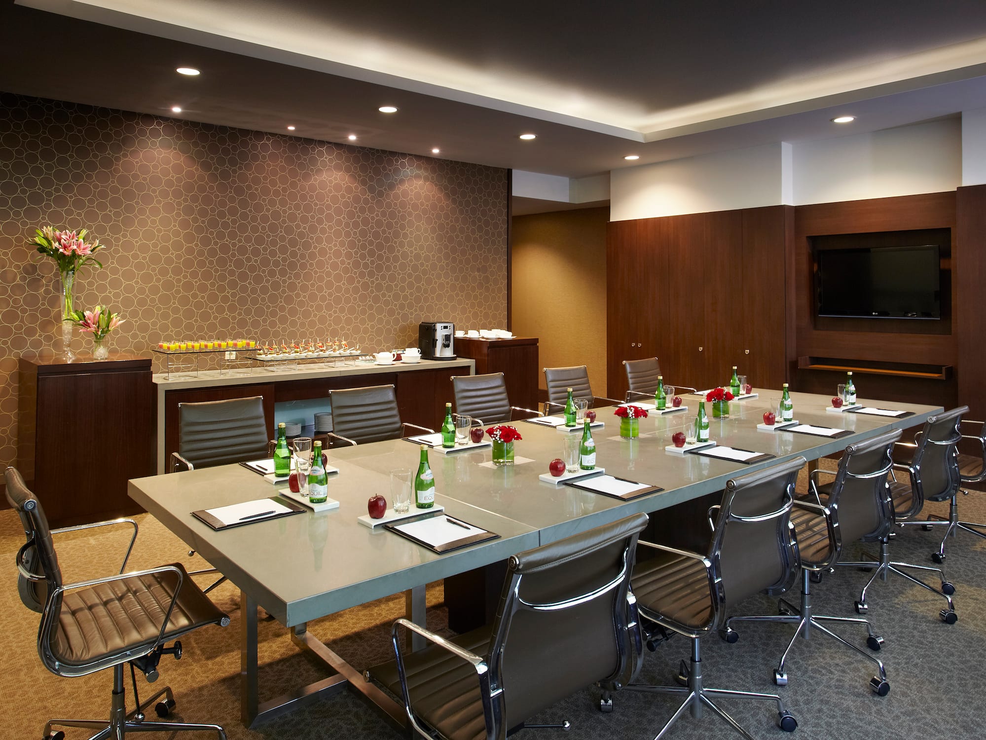 a conference room with a table and chairs