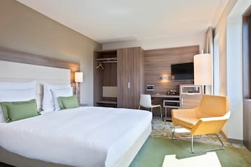 a room with a bed and a chair