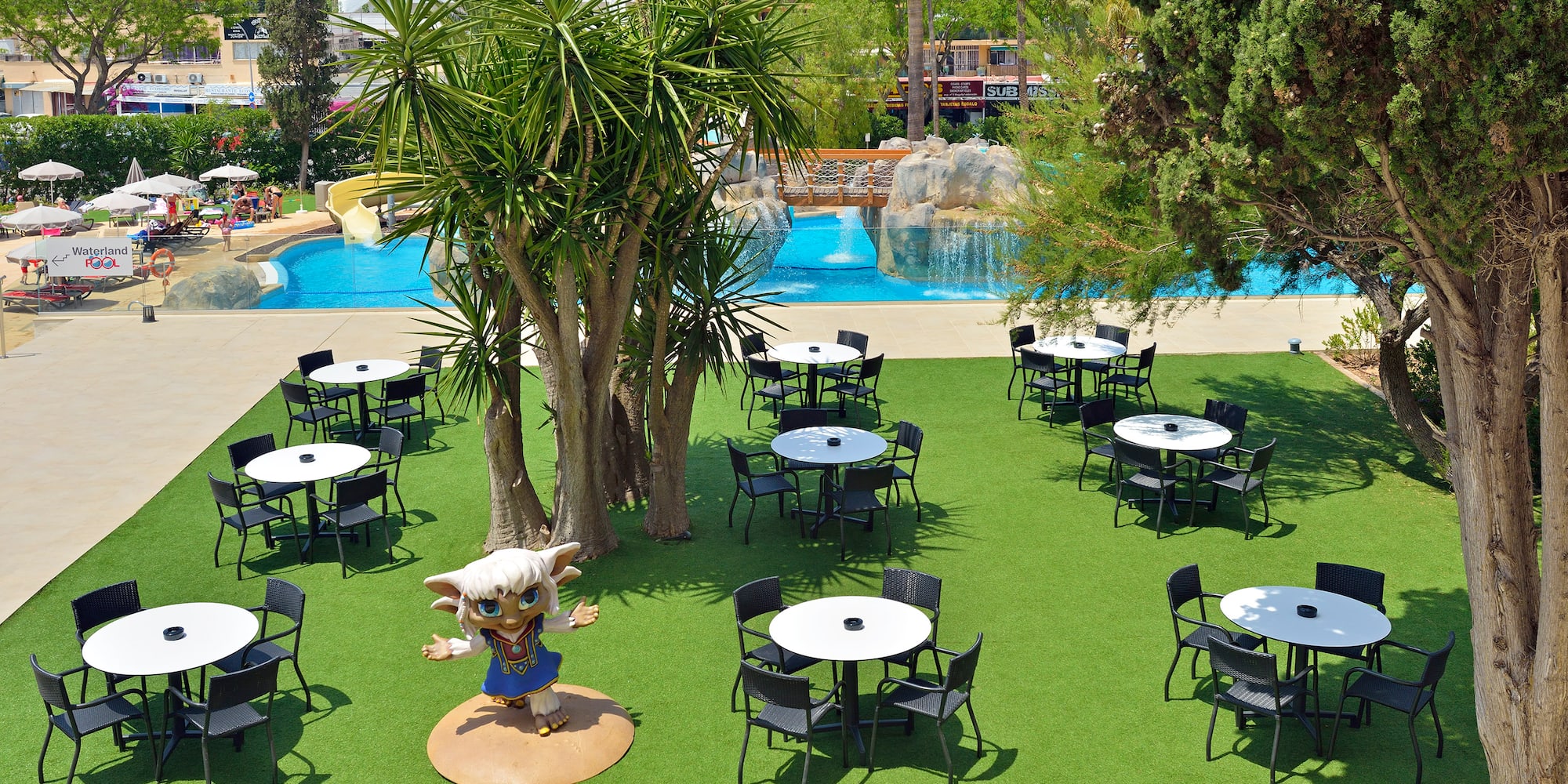 a group of tables and chairs in a park
