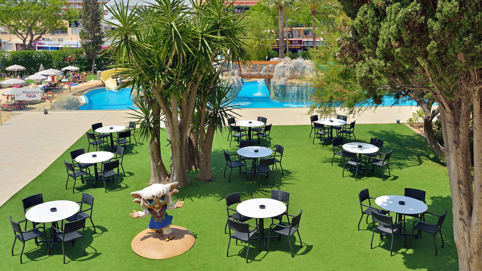 a group of tables and chairs in a park