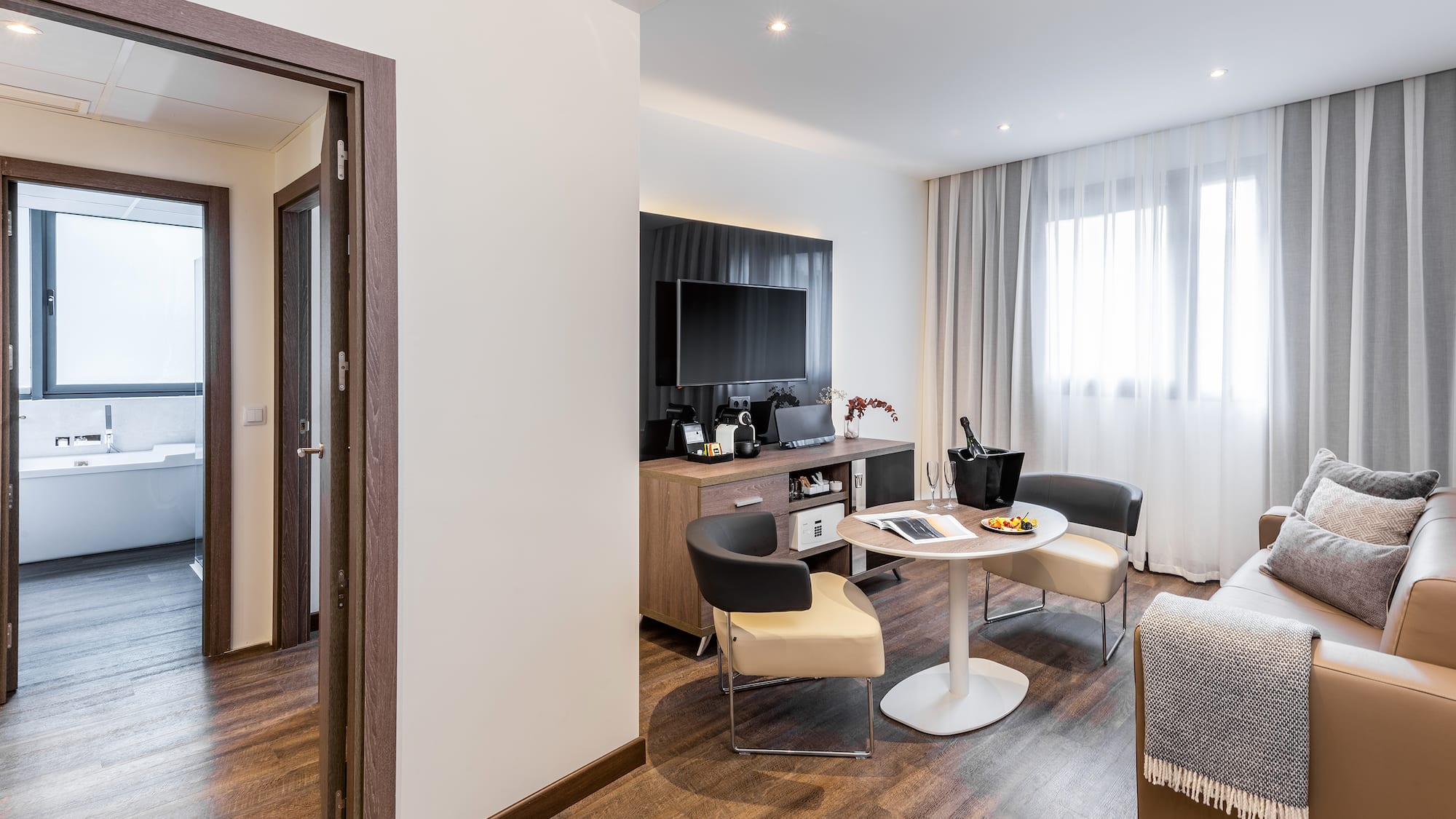 a room with a table and chairs