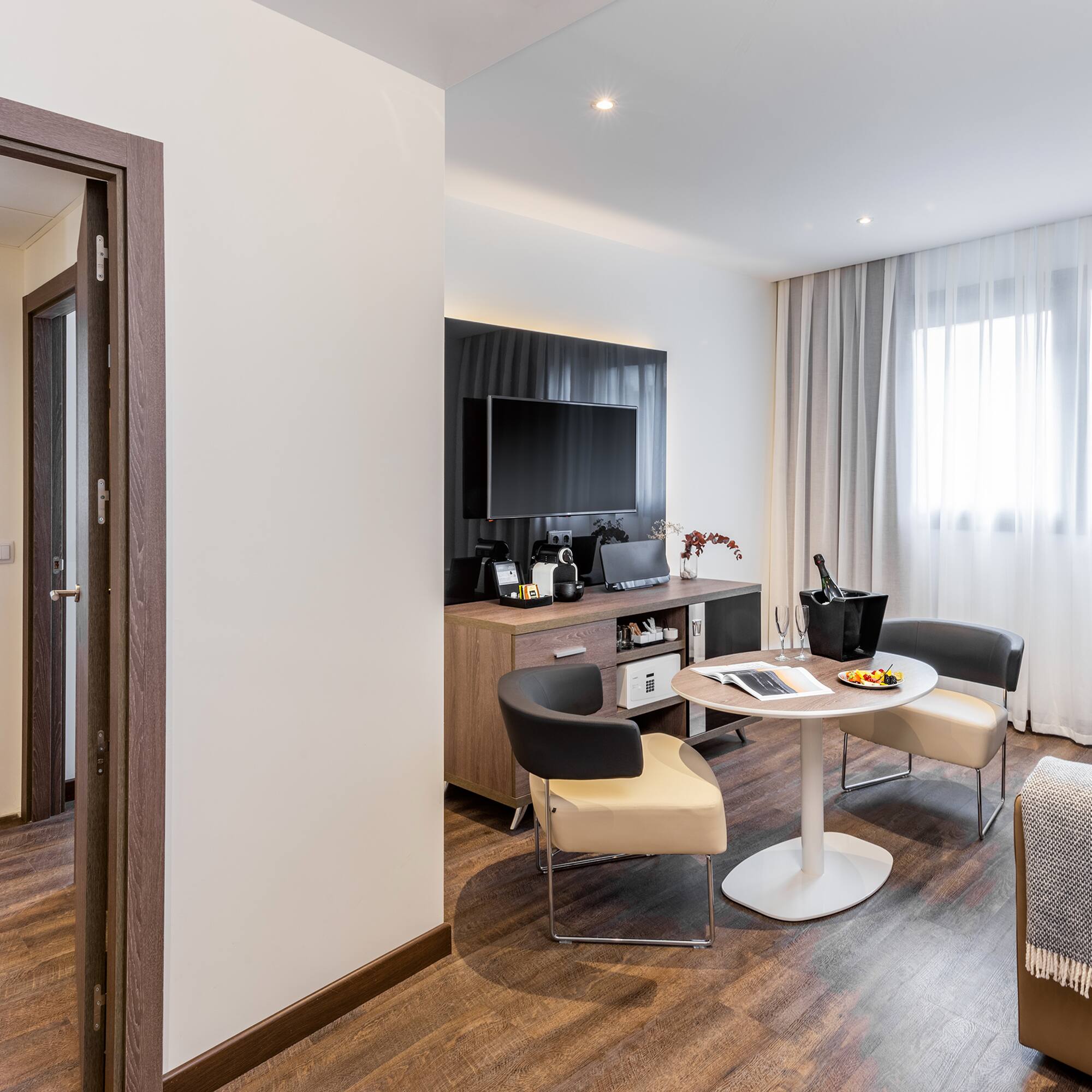 a room with a table and chairs