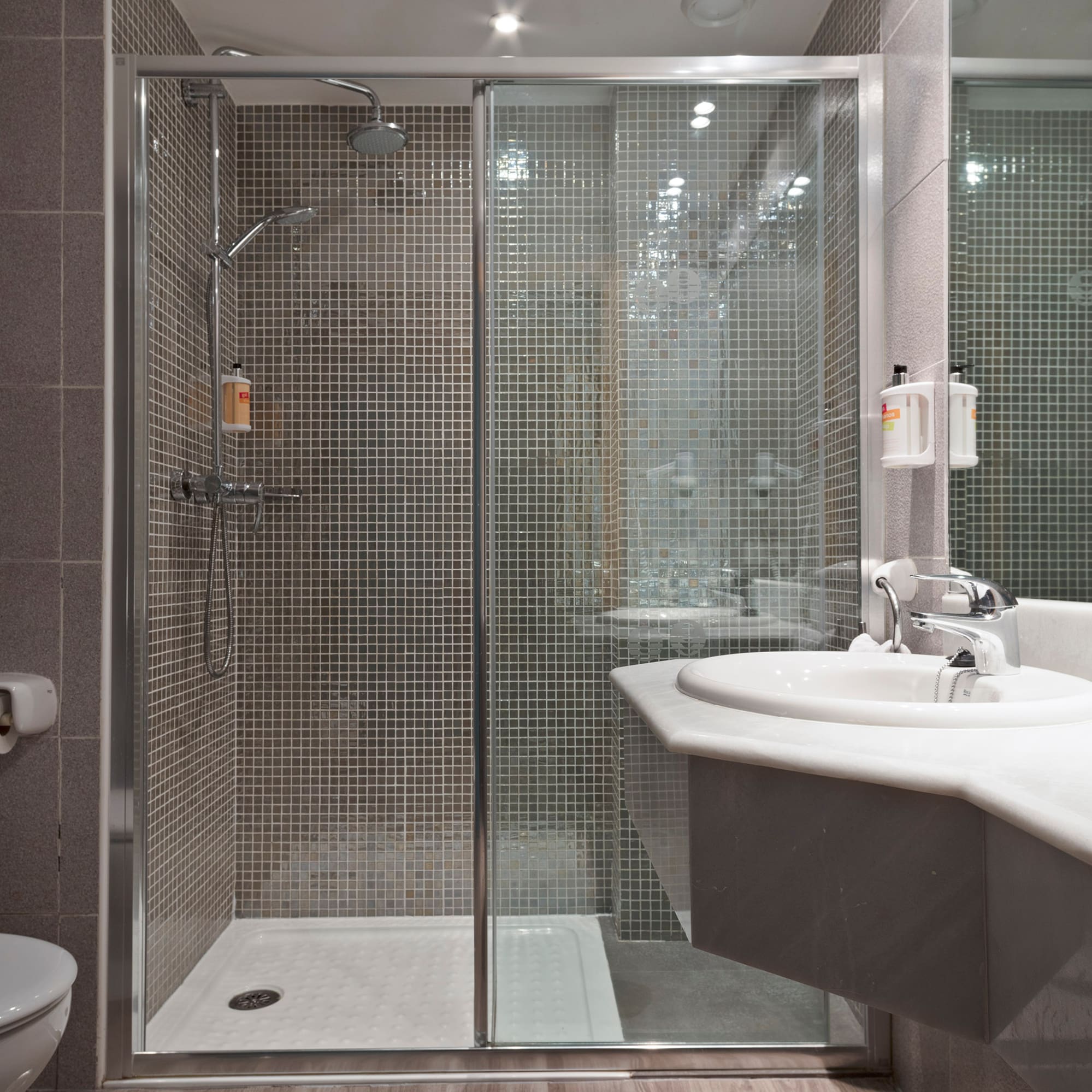 a bathroom with a shower and sink