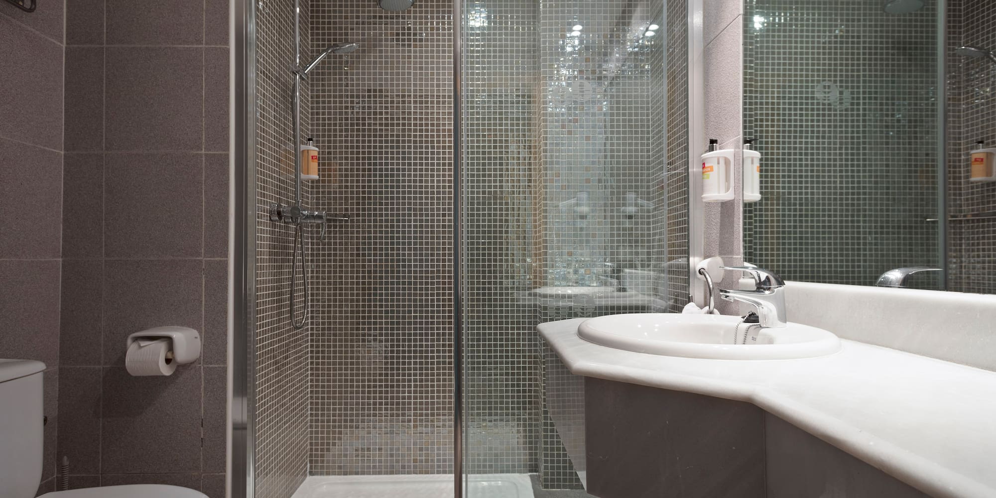 a bathroom with a shower and sink