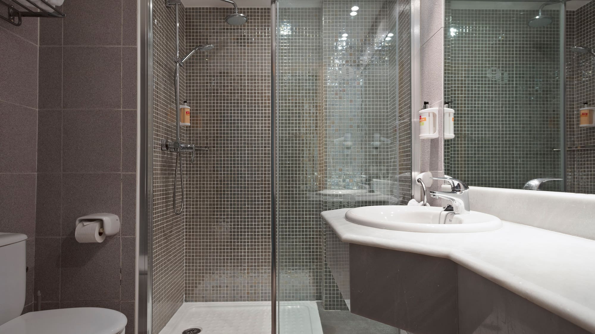 a bathroom with a shower and sink