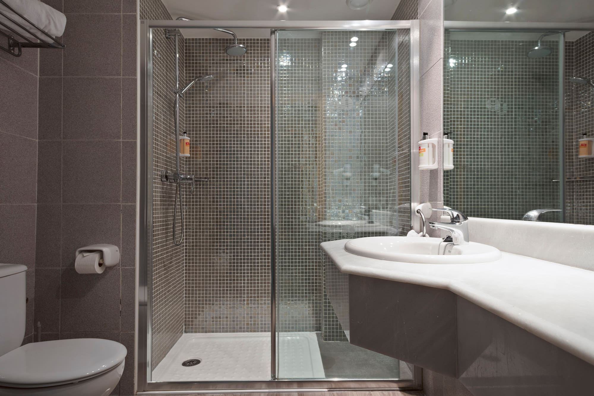 a bathroom with a shower and sink
