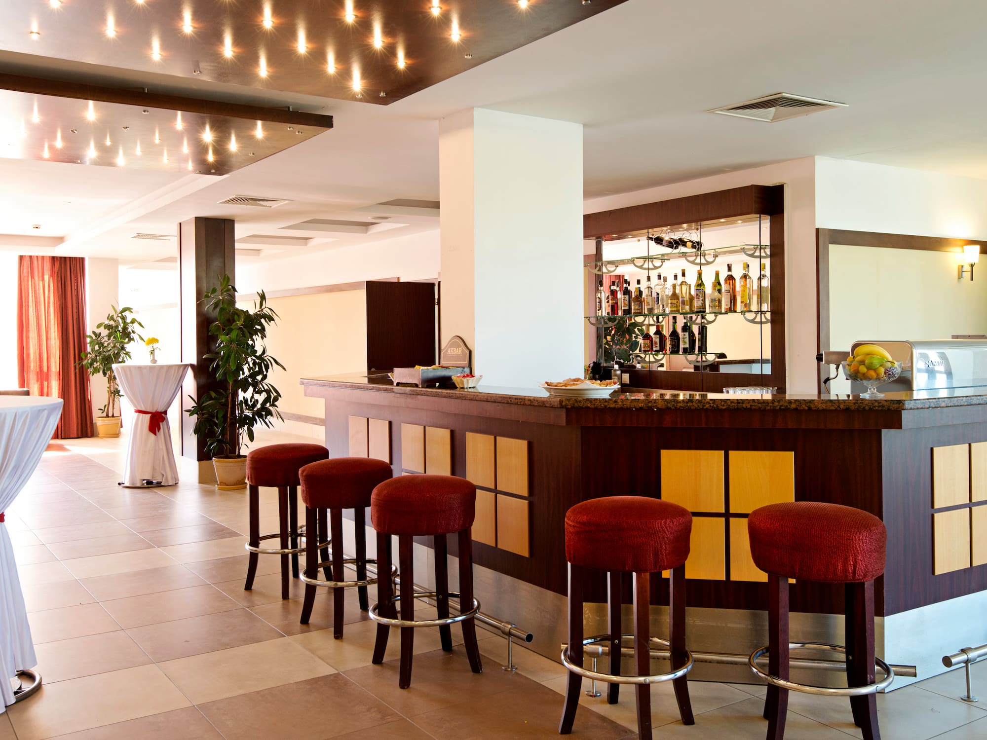 a bar with stools in a room