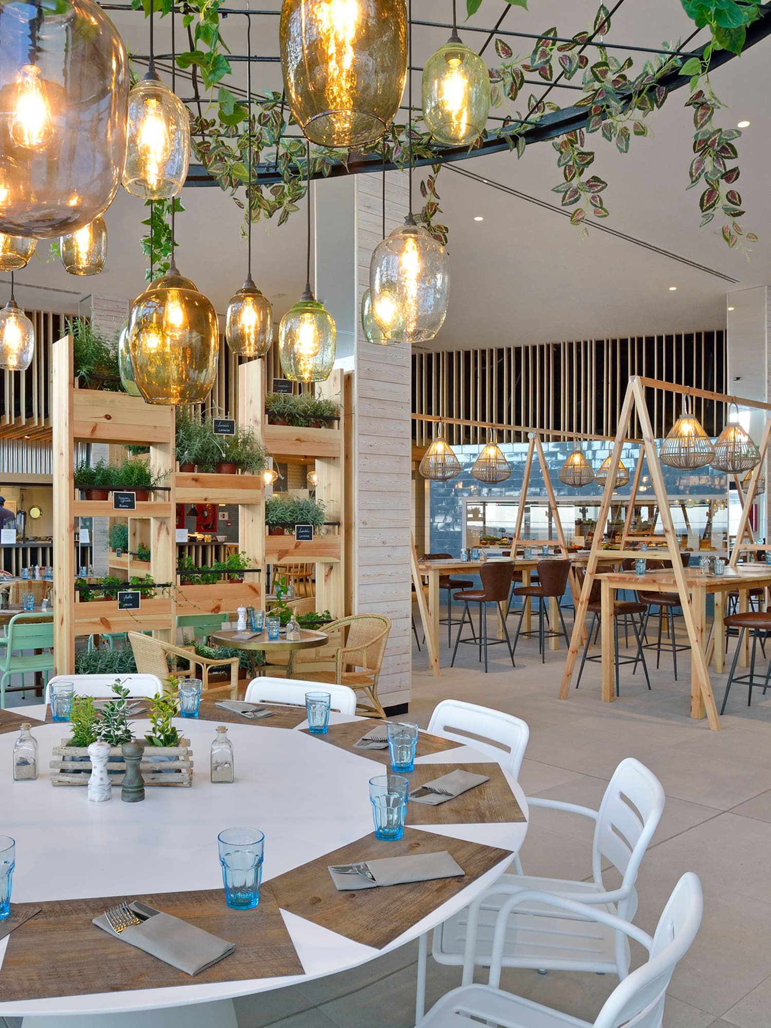 a room with tables and chairs and a chandelier