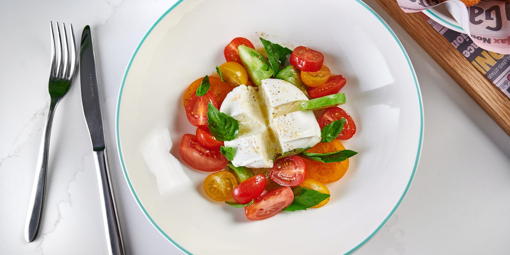 a plate of food with a knife and fork