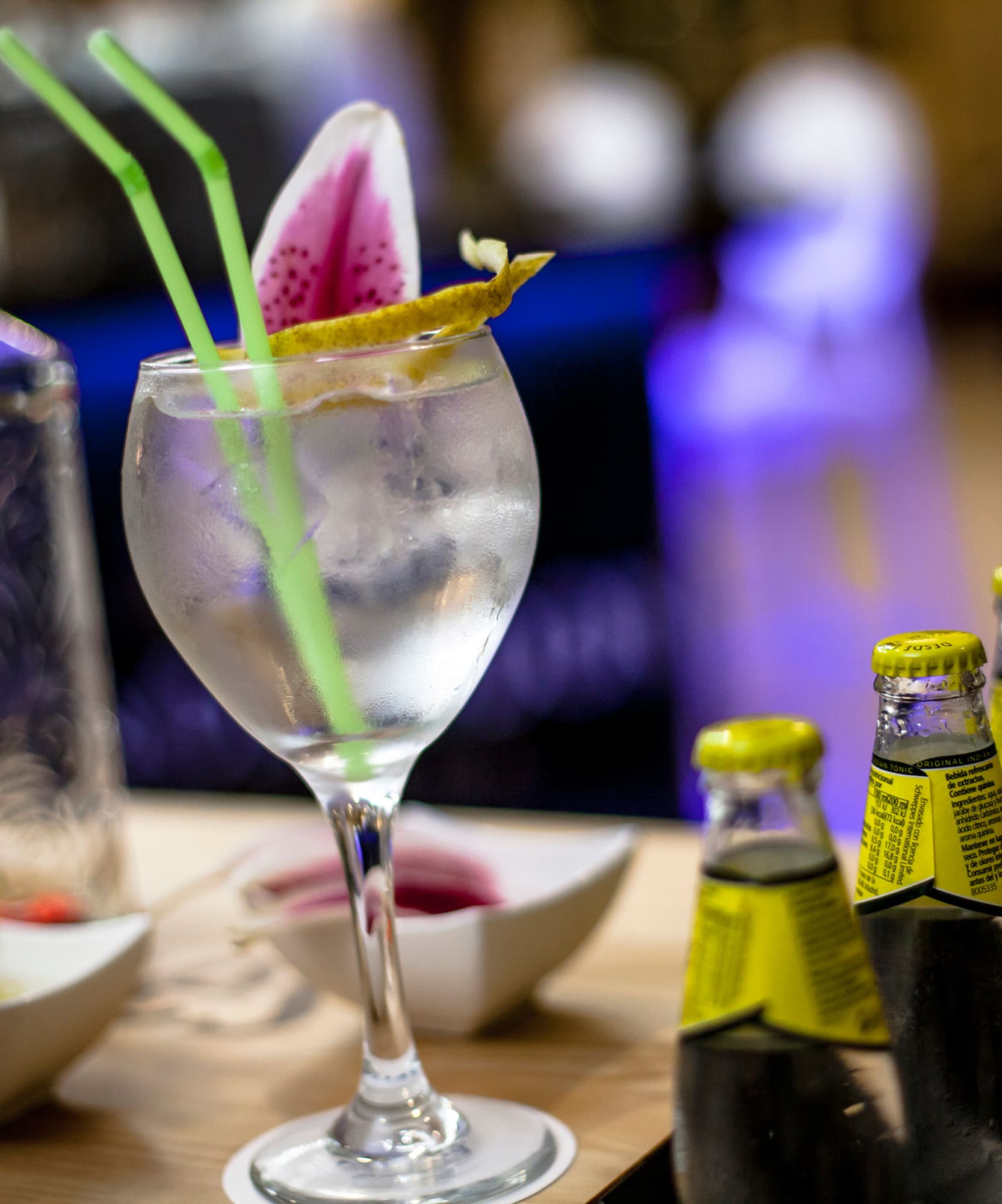 a glass with ice and a flower on it