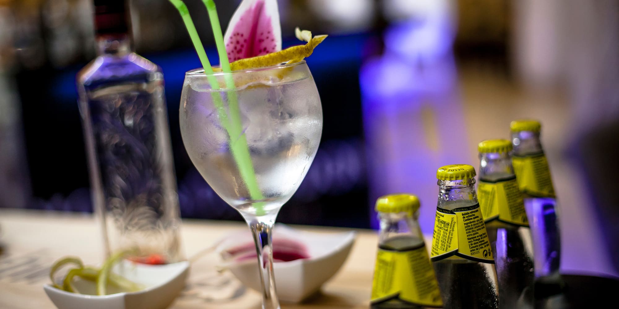 a glass with ice and a flower on it