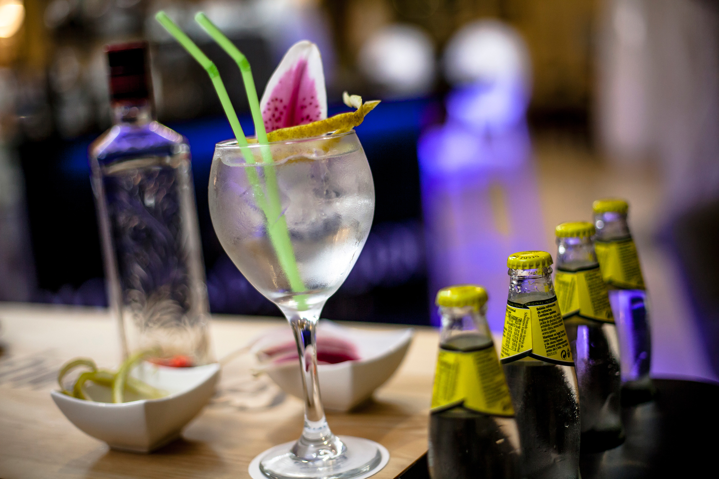 a glass with ice and a flower on it