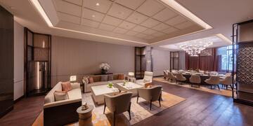 a room with a large table and chairs