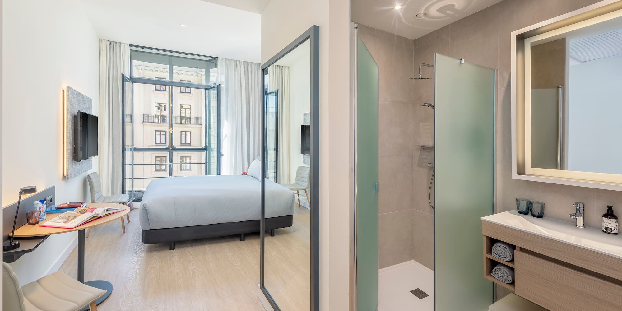 a bathroom with a bed and shower