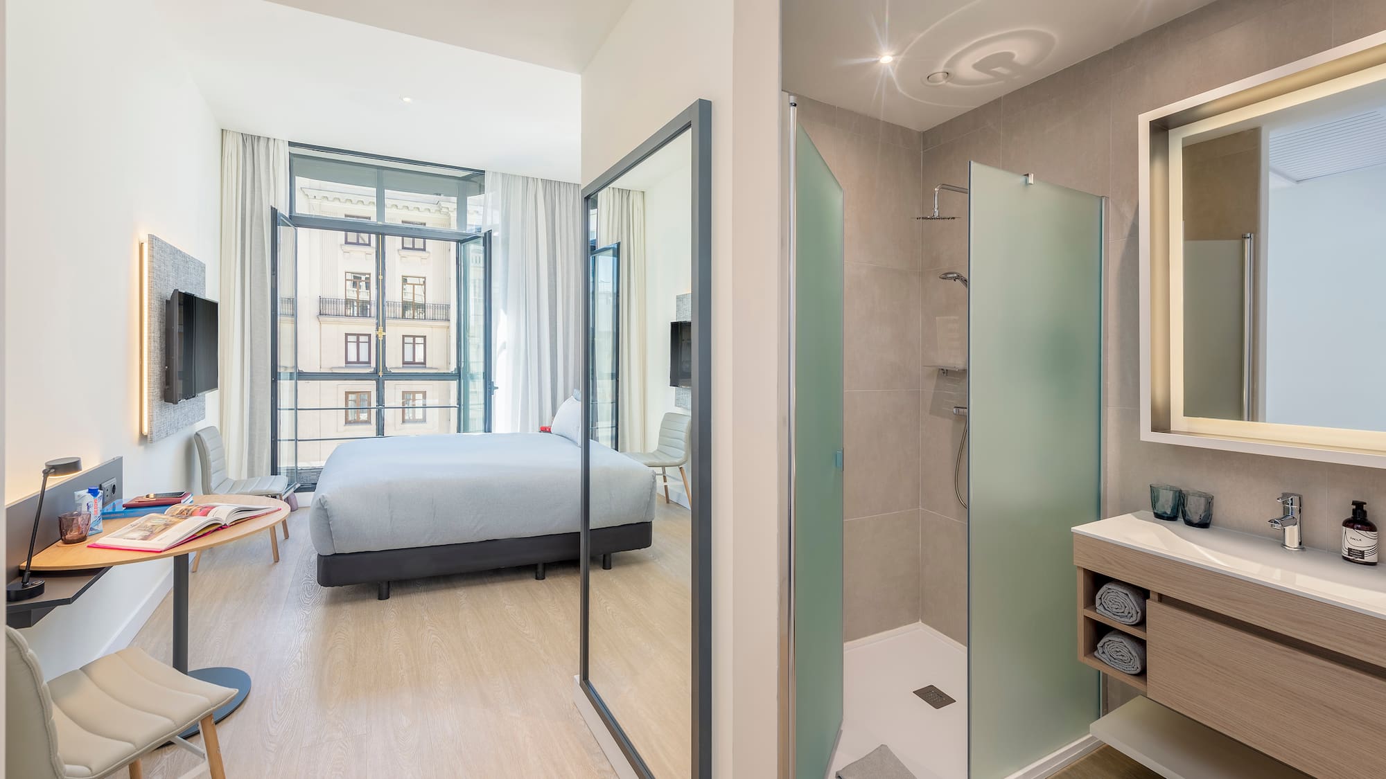 a bathroom with a bed and shower