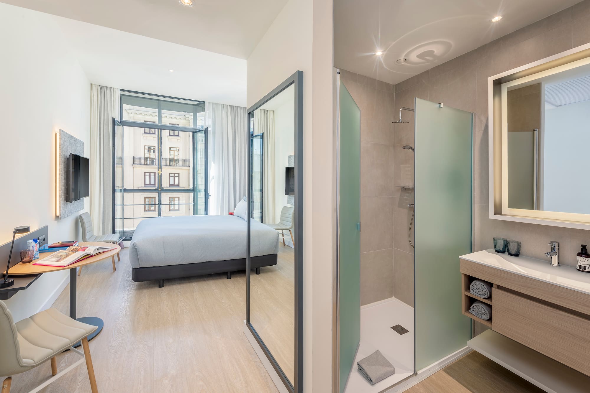 a bathroom with a bed and shower