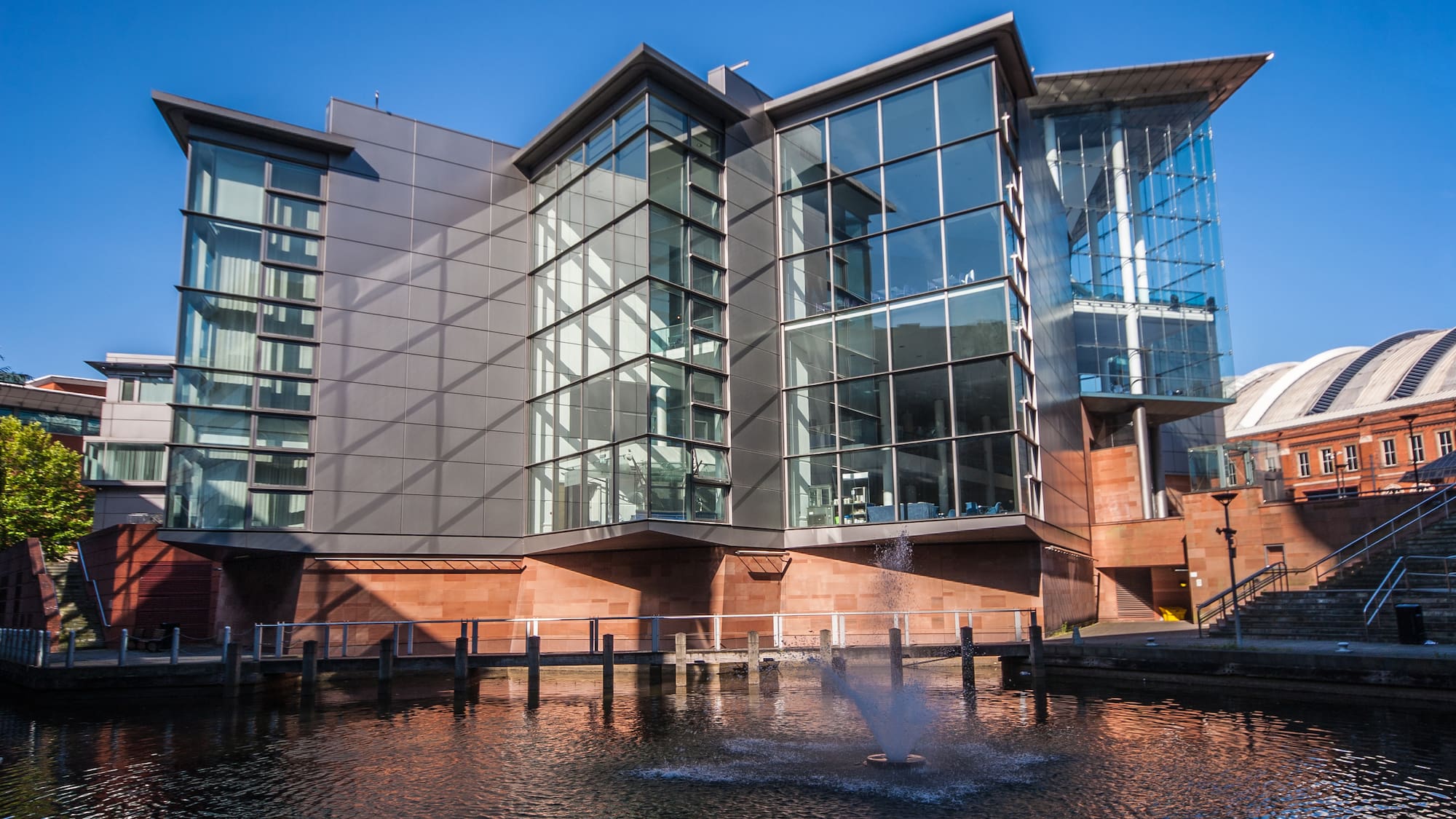a building with a fountain in front of it