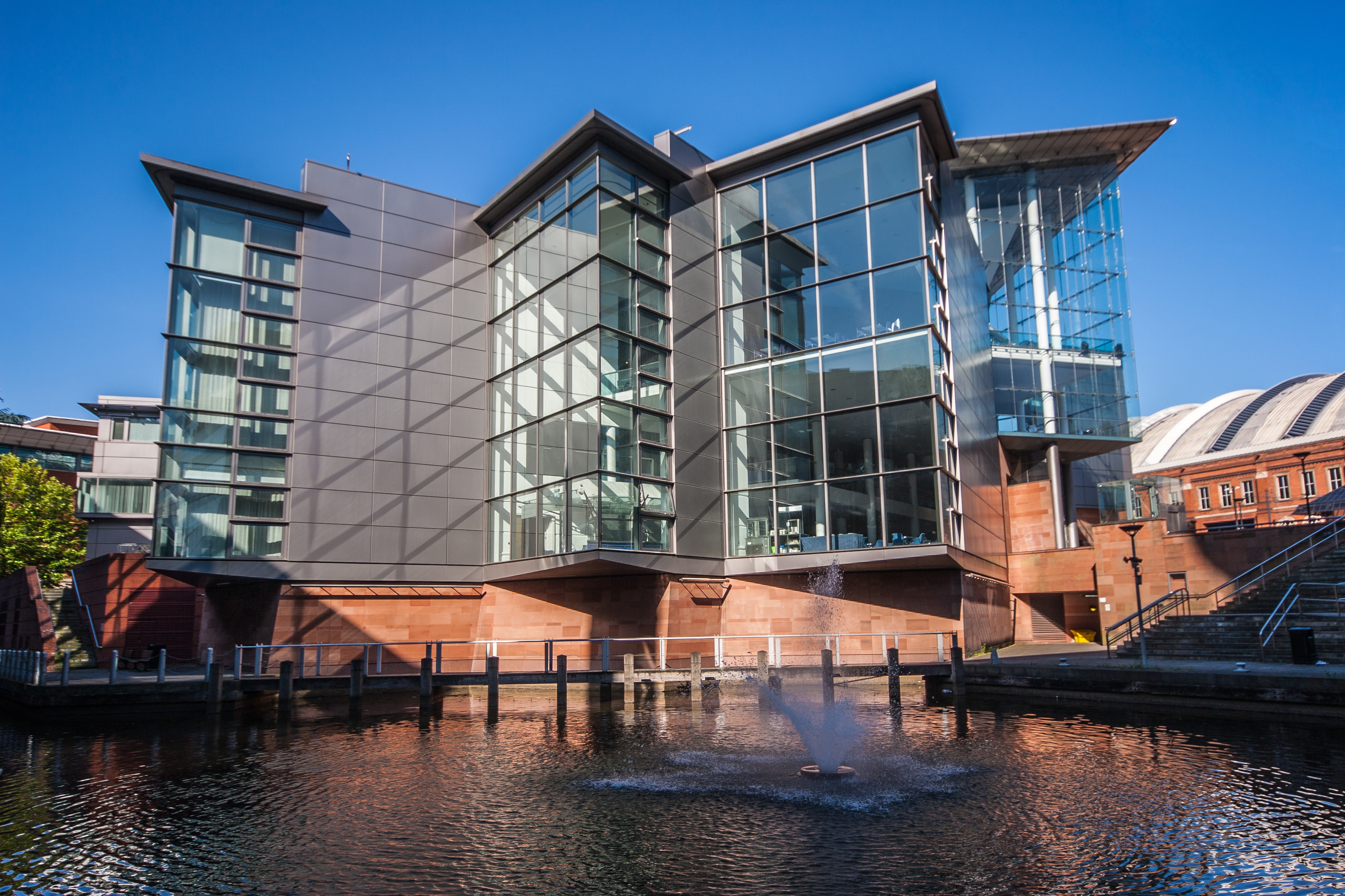 a building with a fountain in front of it