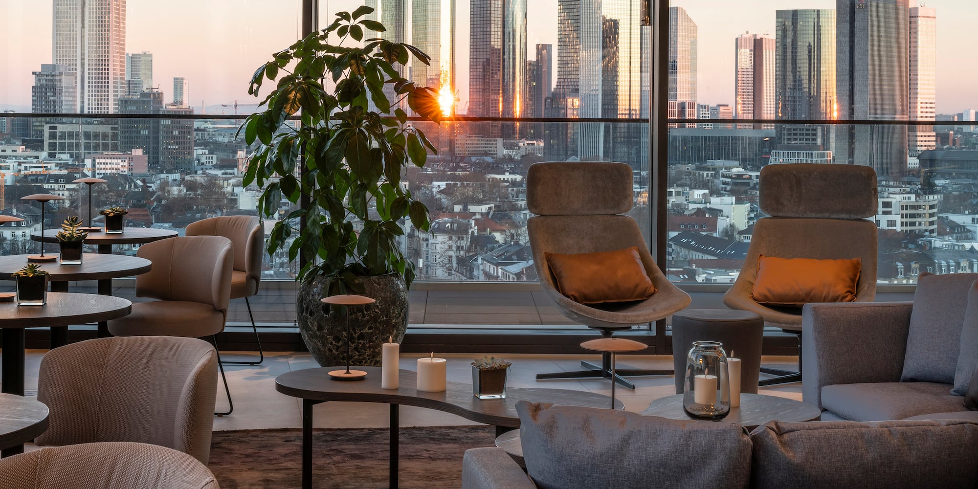 a room with a large window and a large city view