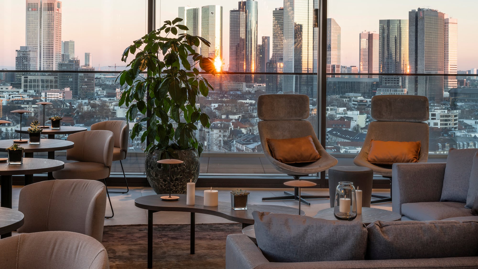 a room with a large window and a large city view