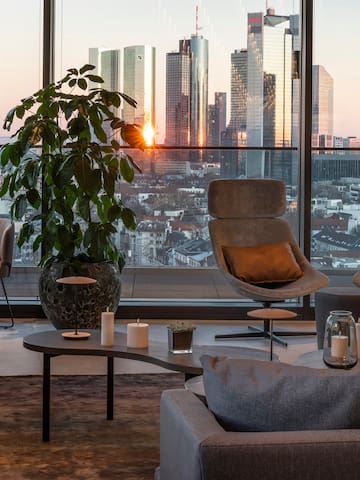 a room with a large window and a large city view