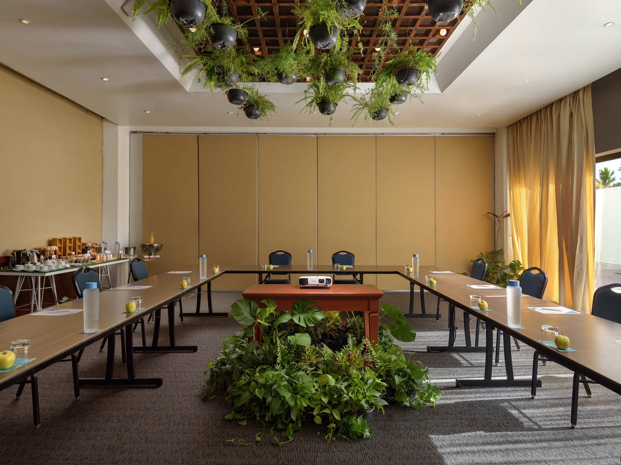 a room with long tables and chairs