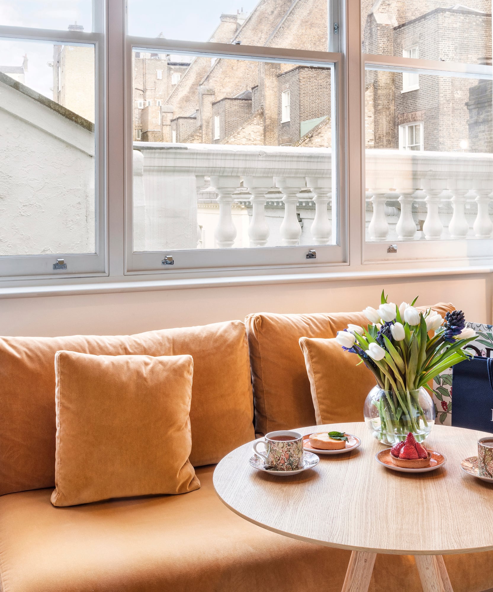 a couch with a coffee table and a bag on it