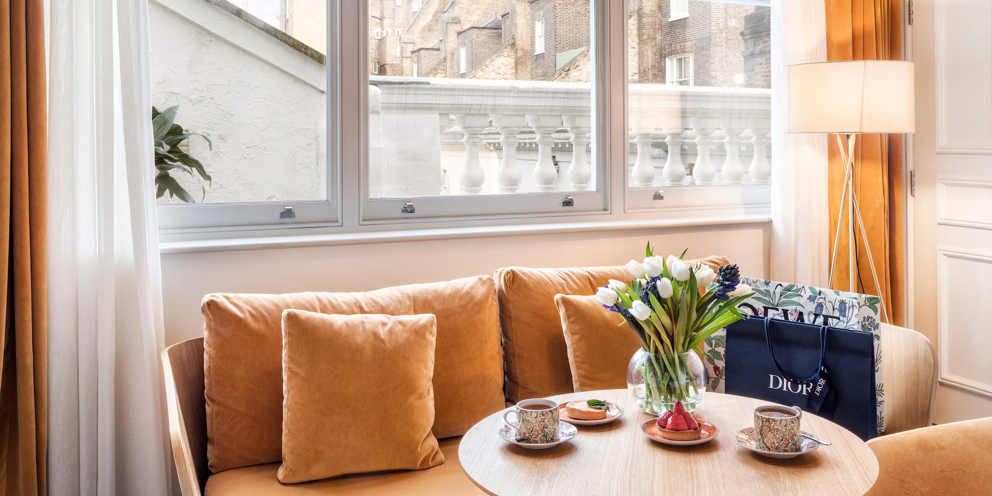 a couch with a coffee table and a bag on it