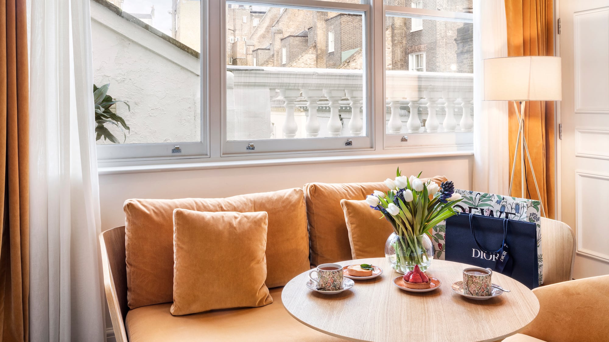 a couch with a coffee table and a bag on it