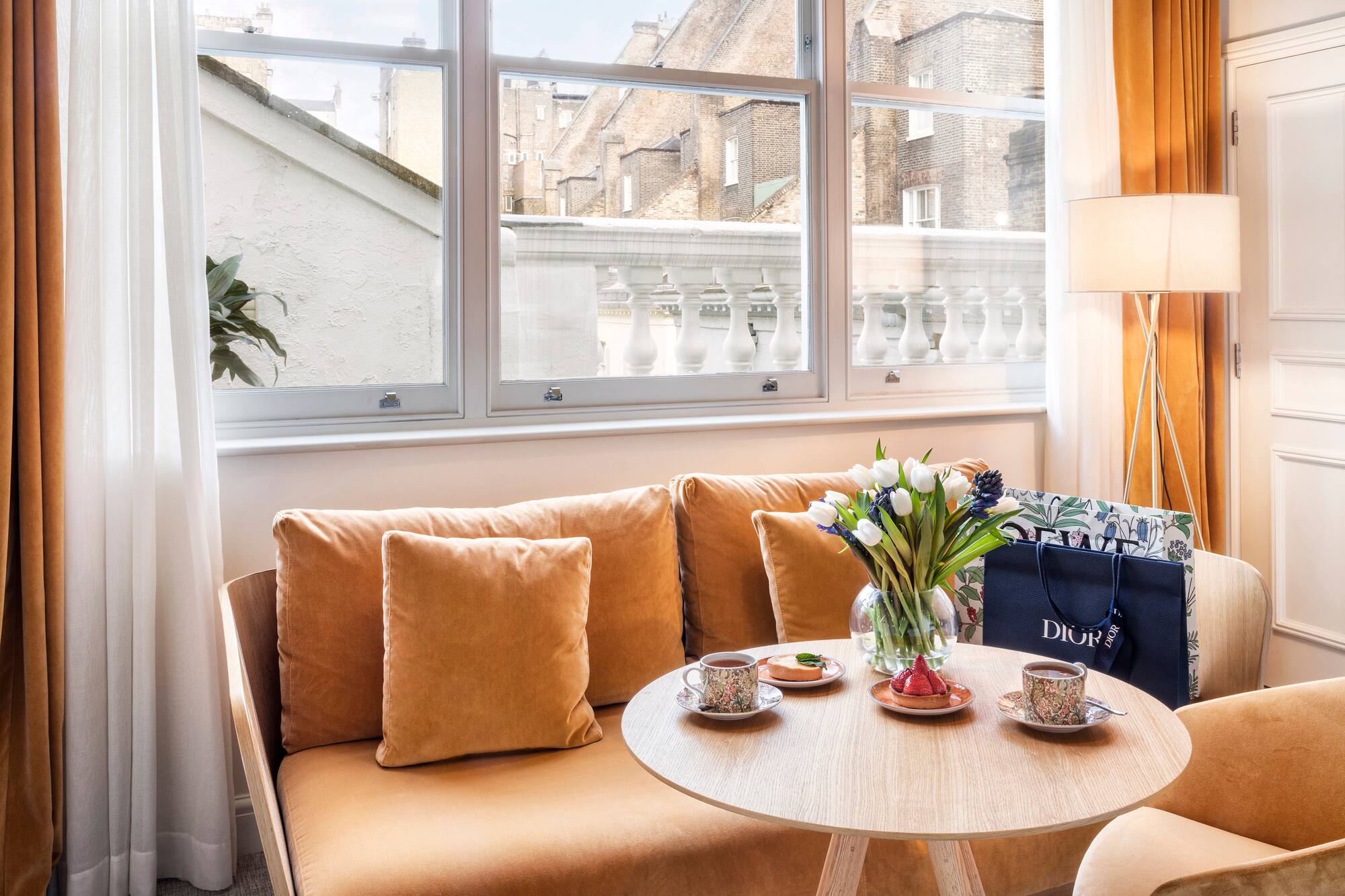a couch with a coffee table and a bag on it