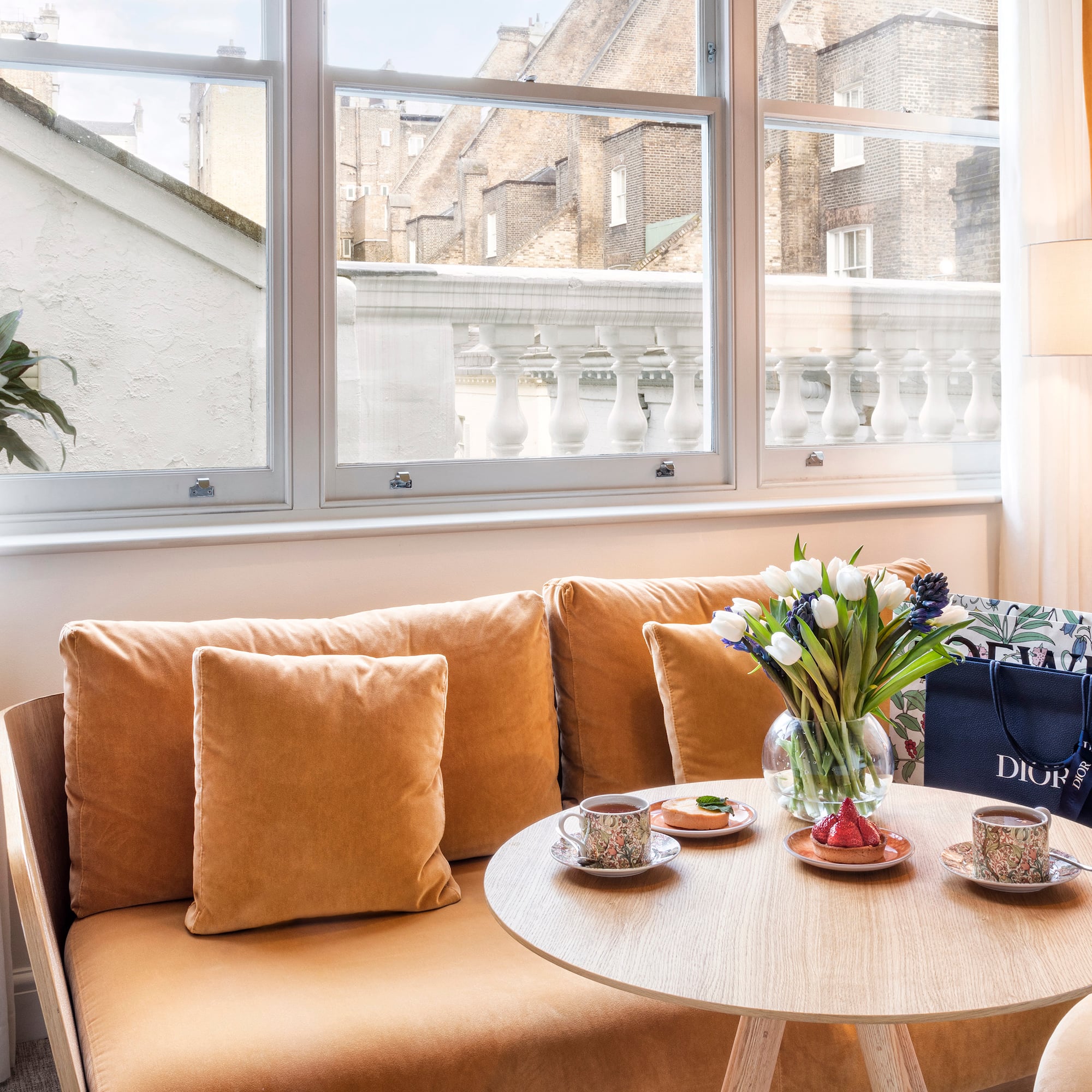 a couch with a coffee table and a bag on it