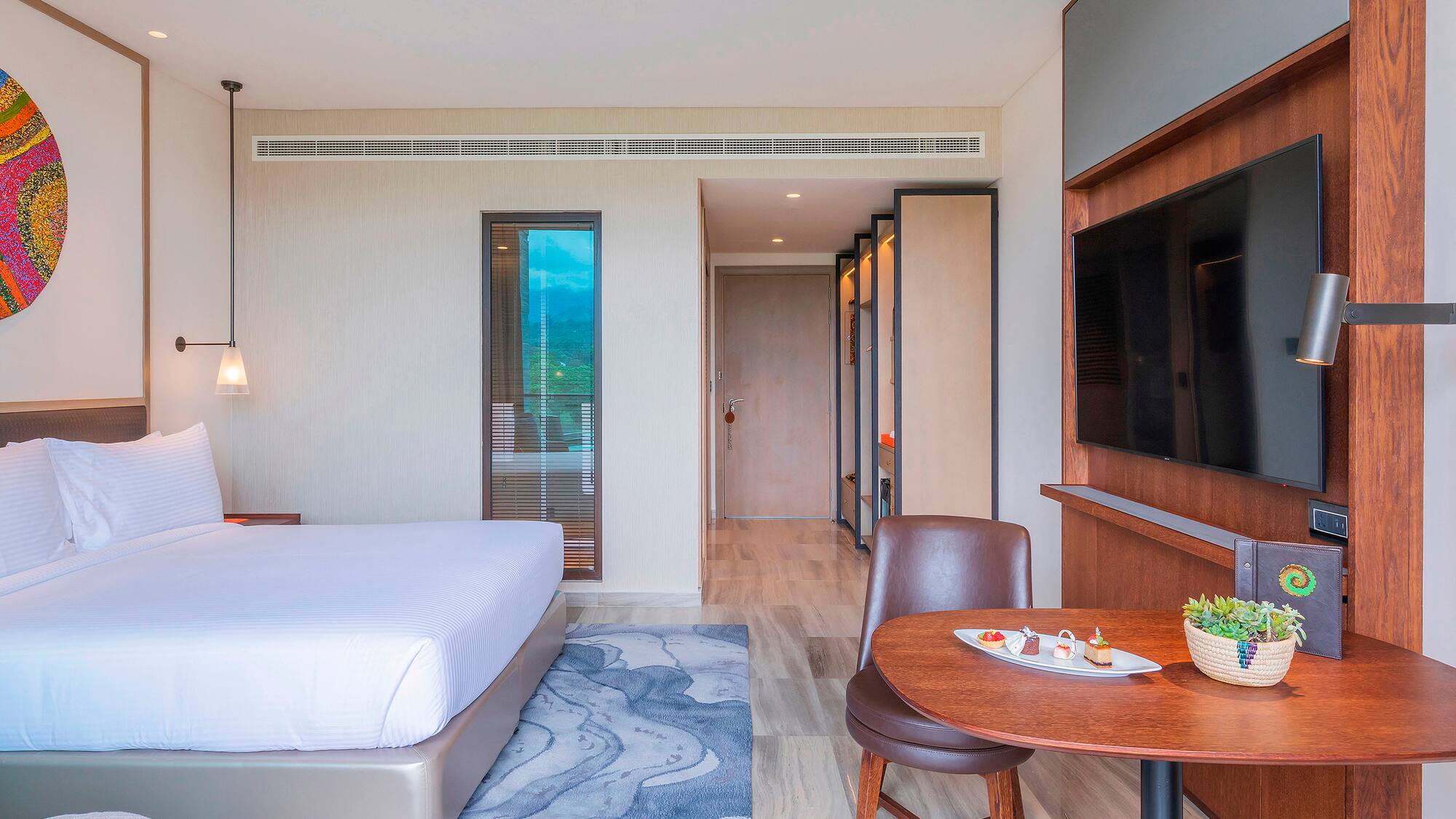 a room with a bed and a tv