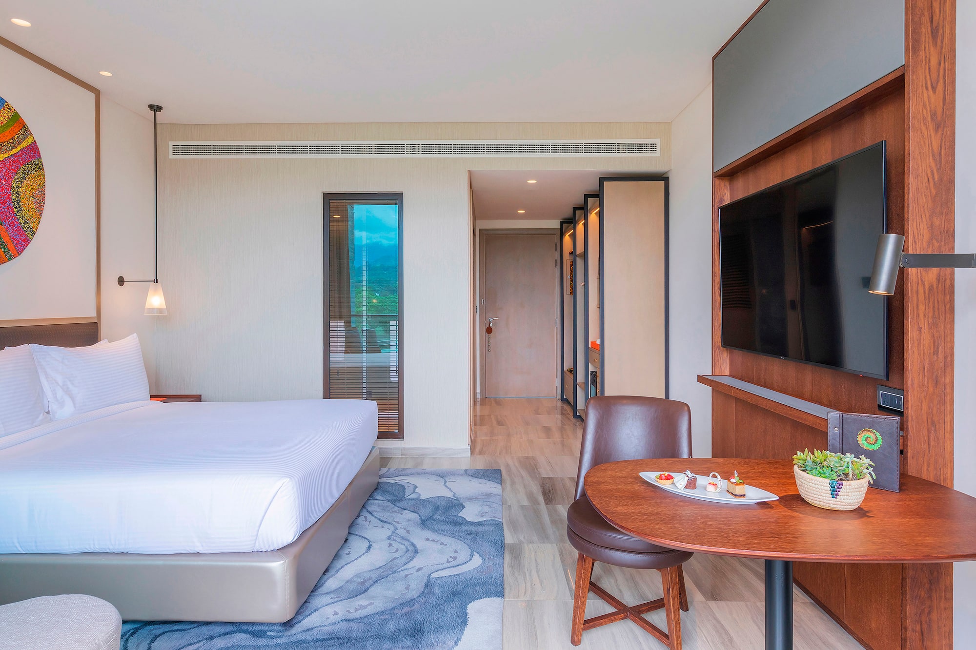 a room with a bed and a tv