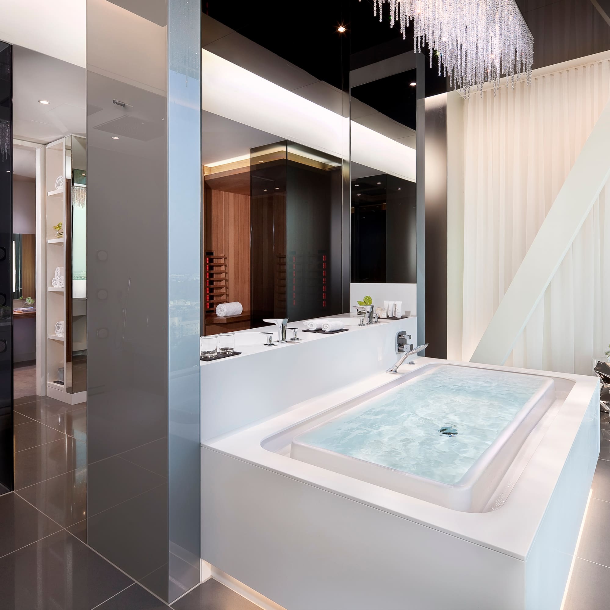 a large white bathtub in a bathroom
