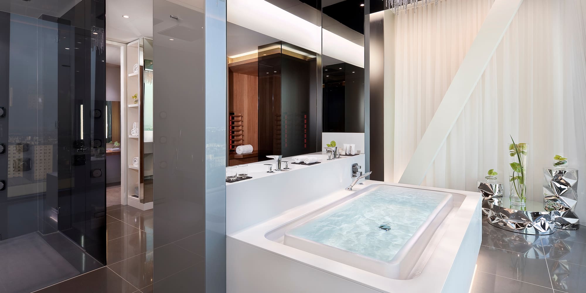 a large white bathtub in a bathroom