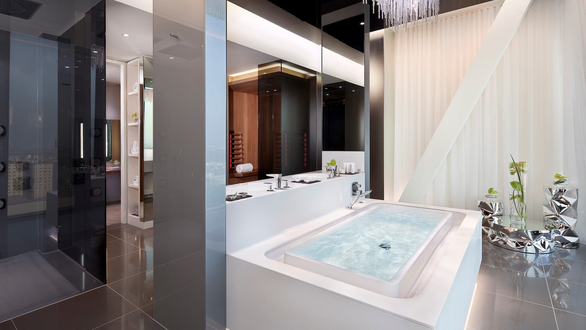 a large white bathtub in a bathroom