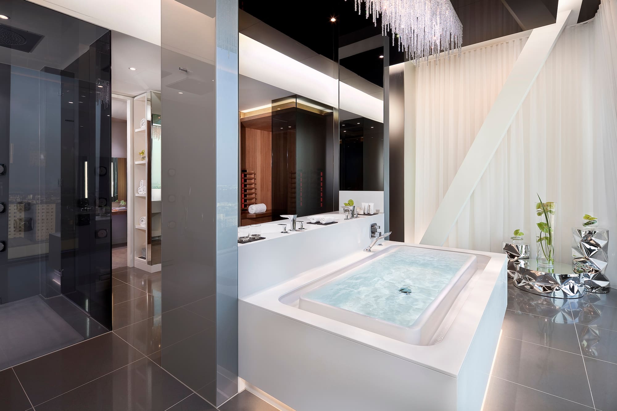 a large white bathtub in a bathroom