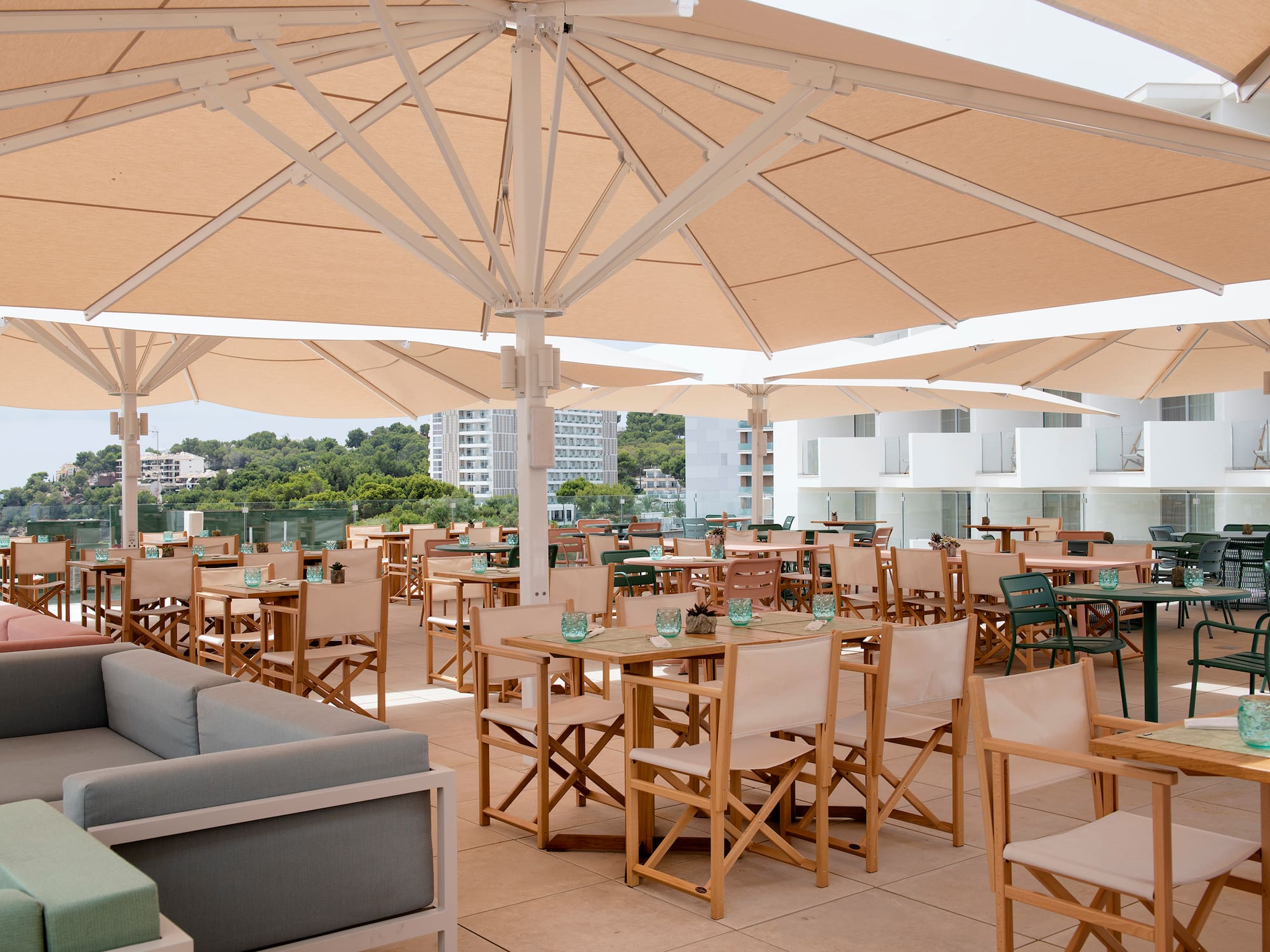 a patio with tables and chairs